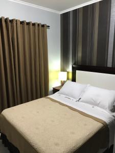 Ein Bett oder Betten in einem Zimmer der Unterkunft Ocio Apart