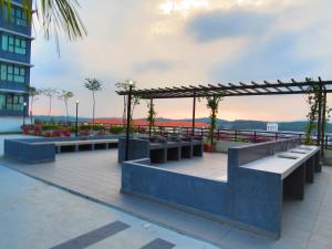 a view from the roof of a building with benches at Santorini by J&G Vacation Homes in Skudai