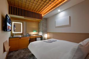 En eller flere senge i et værelse på HOTEL HILLARYS Akasaka