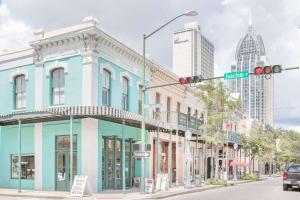 a street corner in a city with a traffic light at Super 8 by Wyndham Mobile in Mobile