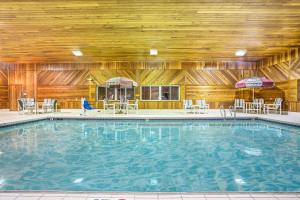 The swimming pool at or close to Super 8 by Wyndham Osseo WI
