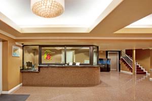a lobby of a hotel with a reception counter at Super 8 by Wyndham Los Angeles Downtown in Los Angeles