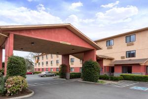 a view of a building with a parking lot at Super 8 by Wyndham Corvallis in Corvallis