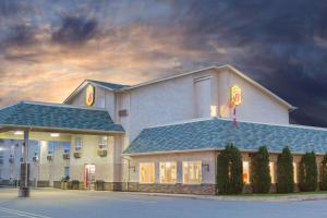 a rendering of a hotel with a building at Super 8 by Wyndham Fort Frances in Fort Frances