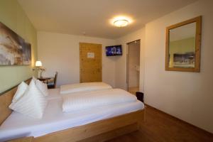 Postel nebo postele na pokoji v ubytování Hotel Munde