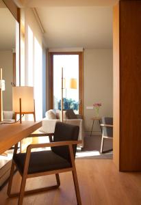 a living room with a couch and a table at Hotel Arima & Spa - Small Luxury Hotels in Donostia-San Sebastián