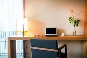 a desk with a laptop computer on top of it at Hotel Arima & Spa - Small Luxury Hotels in Donostia-San Sebastián