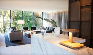 a living room with couches and chairs and a table at Hotel Arima & Spa - Small Luxury Hotels in Donostia-San Sebastián