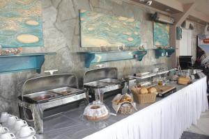 a buffet line with food on top of it at Santa Rosa Hotel & Beach in Alexandroupoli