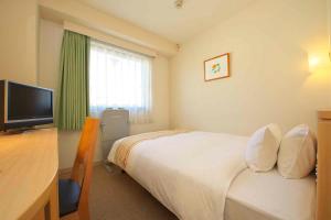 Postel nebo postele na pokoji v ubytování Chisun Hotel Hiroshima