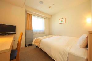 Postel nebo postele na pokoji v ubytování Chisun Hotel Hiroshima