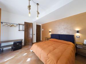 a bedroom with a large bed in a room at B&B Le Ginestre in Cefalù +91 photos