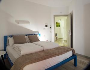 Postel nebo postele na pokoji v ubytování B&B Perbacco Relax
