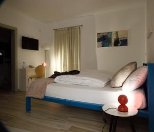 Postel nebo postele na pokoji v ubytování B&B Perbacco Relax