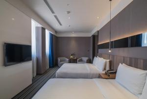 Ένα ή περισσότερα κρεβάτια σε δωμάτιο στο WESTGATE Hotel