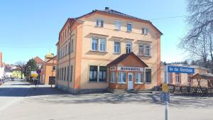 a building on the corner of a street at Bahnhotel Dippoldiswalde in Dippoldiswalde