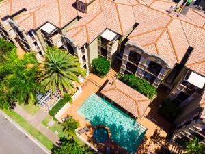 an overhead view of a swimming pool in front of a building at Beaches On Wave Street in Gold Coast