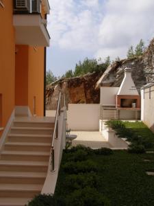 a set of stairs leading up to a building at Apartments Martina in Prizba