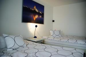 Postel nebo postele na pokoji v ubytování N1 Standalone House Baden