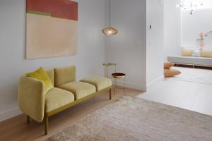 a living room with a couch and a rug at La Dolce Vita by FeelFree Rentals in San Sebastián