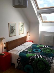 Ein Bett oder Betten in einem Zimmer der Unterkunft Mansarda Bellini 84