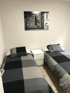 A bed or beds in a room at Corazón de Triana