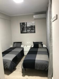A bed or beds in a room at Corazón de Triana