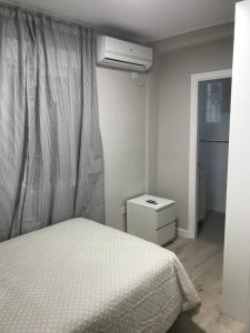 A bed or beds in a room at Corazón de Triana