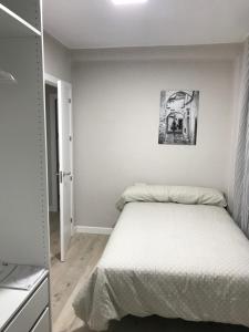 A bed or beds in a room at Corazón de Triana