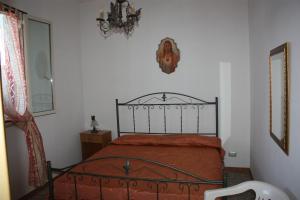 Postel nebo postele na pokoji v ubytování Carrube House