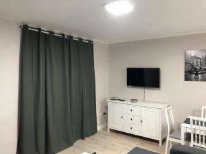 A television and/or entertainment centre at Corazón de Triana