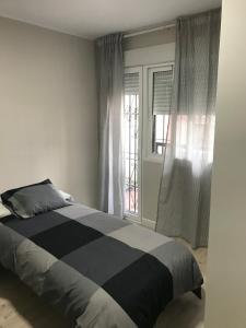 A bed or beds in a room at Corazón de Triana