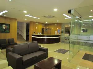 a lobby with a couch and a table and a bar at Sao Tomas in Fátima