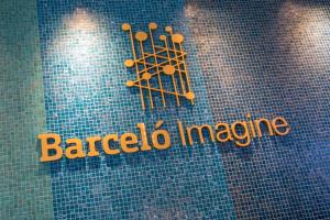 a sign that says baracco incamine on a tile wall at Barceló Imagine in Madrid