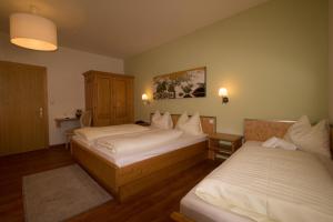 Postel nebo postele na pokoji v ubytování Hotel Munde