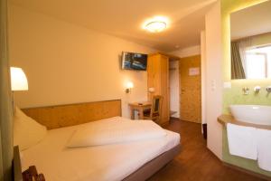 Postel nebo postele na pokoji v ubytování Hotel Munde