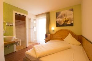 Postel nebo postele na pokoji v ubytování Hotel Munde