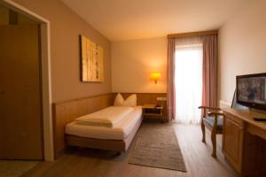 Кровать или кровати в номере Hotel Munde