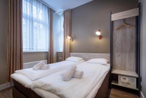
Cama o camas de una habitación en Amsterdam Downtown Hotel

