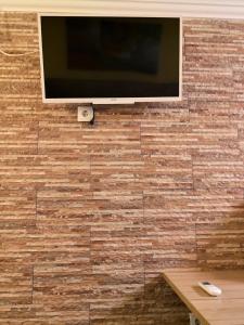 A television and/or entertainment center at Central Praia Beach House