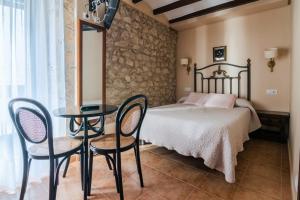 Säng eller sängar i ett rum på Casa Banys L'Avellà