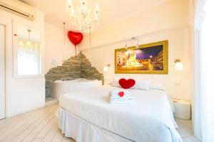 Ένα ή περισσότερα κρεβάτια σε δωμάτιο στο Suites Roma Tiburtina +34 φωτογραφίες