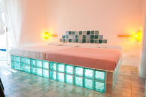 Letto o letti in una camera di Suite House L'Isola Che Non C'è