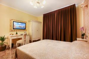 TV a/nebo společenská místnost v ubytování New Reiter Hotel