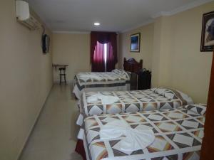 Krevet ili kreveti u jedinici u okviru objekta Hotel Tarento Suite