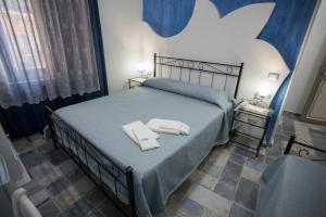 Postel nebo postele na pokoji v ubytování Coraje Room & Breakfast