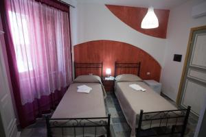 Postel nebo postele na pokoji v ubytování Coraje Room & Breakfast