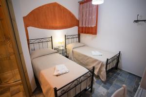 Postel nebo postele na pokoji v ubytování Coraje Room & Breakfast