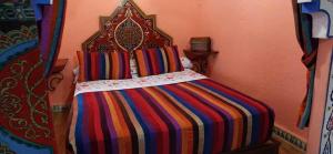 Un pat sau paturi într-o cameră la Dar Antonio