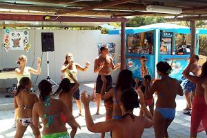 a group of people in bathing suits dancing at a party at Camping Victoria in Capaccio-Paestum +33 photos